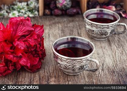 Tea from Sudanese rose. Medicinal tea decoction of hibiscus tea in stylish cups.