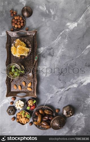 tea glass with dates fruit honeycomb. High resolution photo. tea glass with dates fruit honeycomb. High quality photo