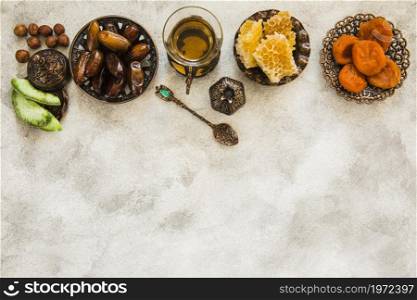 tea glass with different dried fruits honeycomb. High resolution photo. tea glass with different dried fruits honeycomb. High quality photo