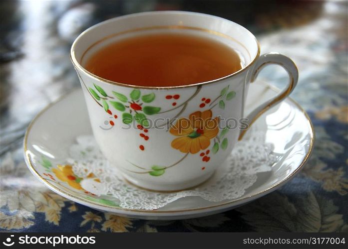 Tea in a cup with saucer, shallow dof