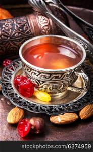 Tea in arab style. Arabic tea with nuts and oriental sweets.Tea still life