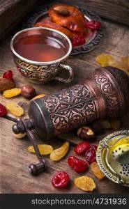 Tea in arab style. turk tea with nuts and oriental sweets.Tea still life