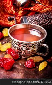 Tea in arab style. turk tea with nuts and oriental sweets.Tea still life