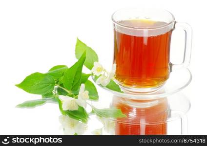 tea in cup with jasmin on white