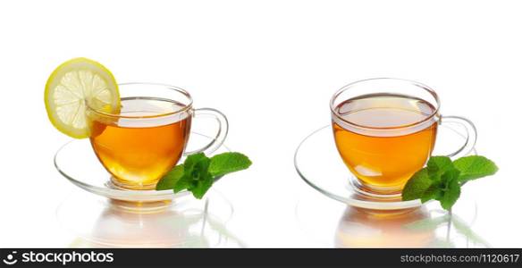 tea in cup with leaf mint and lemon isolated on white background