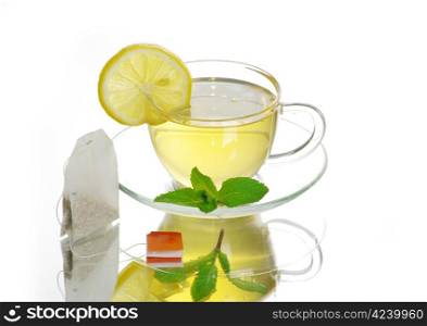 tea in cup with leaf mint isolated on white background