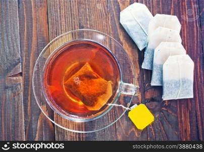 tea in glass cup on the wooden table