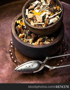 tea leaf in wooden pot. mix of fruit tea leaf in a wooden pot