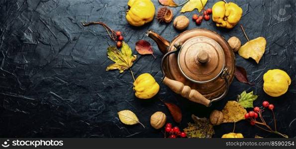 Tea made from apples and quince on an autumn background.Copy space. Fragrant fruit tea