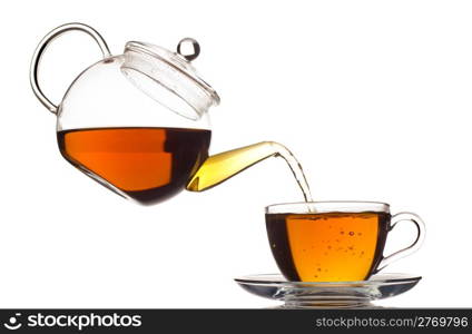 tea pouring in the cup isolated on white