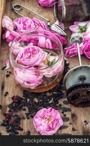 tea rose buds. buds of the tea roses in wooden box with welding in rustic style