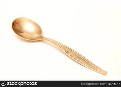 Tea spoon laying isolated on the white background