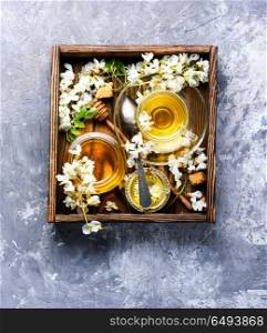 Tea with acacia flavor. Healing herbal tea with honey from acacia flowers.Herbal tea
