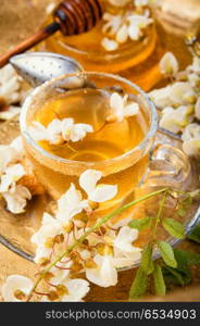 Tea with acacia flavor. Healing herbal tea with honey from acacia flowers.Herbal tea