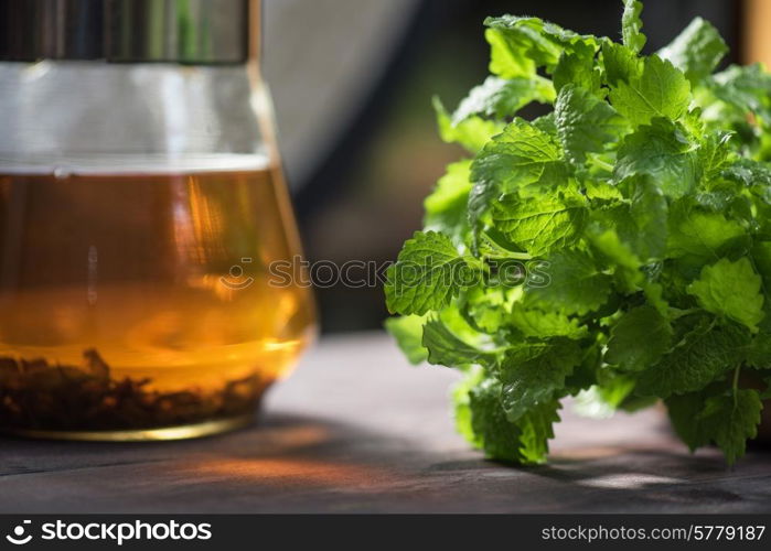 Tea with green fresh melissa leaves close up. melissa tea