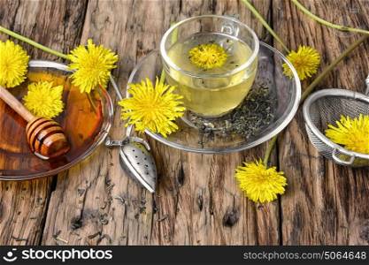 Tea with honey dandelion. Cup of medicinal tea with healthy dandelion honey
