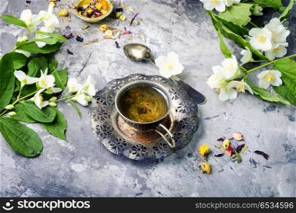 Tea with jasmine. Oriental tea set with tea from jasmine flowers.Jasmine tea