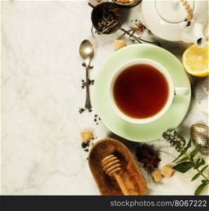 Tea with mint, ginger and lemon on rustic background