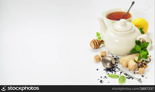 Tea with mint, ginger and lemon on white background