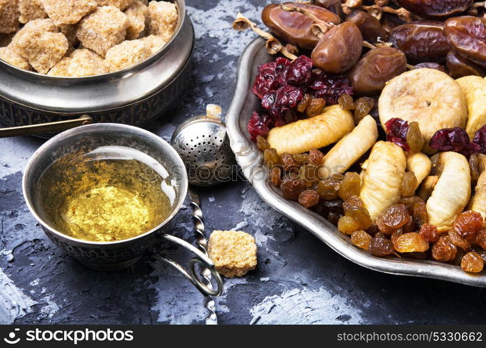 tea with oriental sweets. symbolic oriental tea with figs, dates and oriental sweets