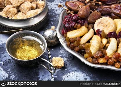 tea with oriental sweets. symbolic oriental tea with figs, dates and oriental sweets