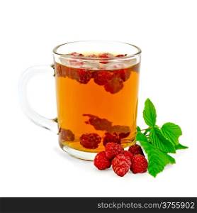 Tea with raspberry in the glass mug, green leaf raspberry isolated on a white background