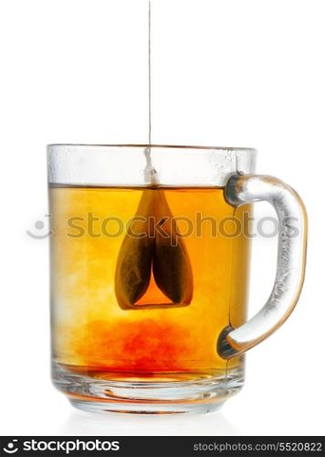 Teabag in the cup with water on white background