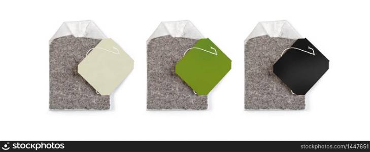 Teabag with white , green and blsck label. Top view. Isolated on a white. with clipping path