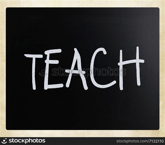 ""Teach" handwritten with white chalk on a blackboard"