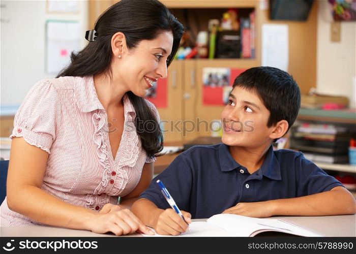 Teacher and schoolboy in class
