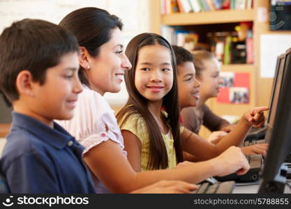 Teacher and schoolchildren in class