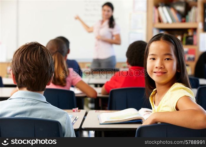Teacher and schoolchildren in class