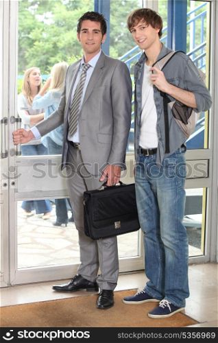Teacher and student leaving building