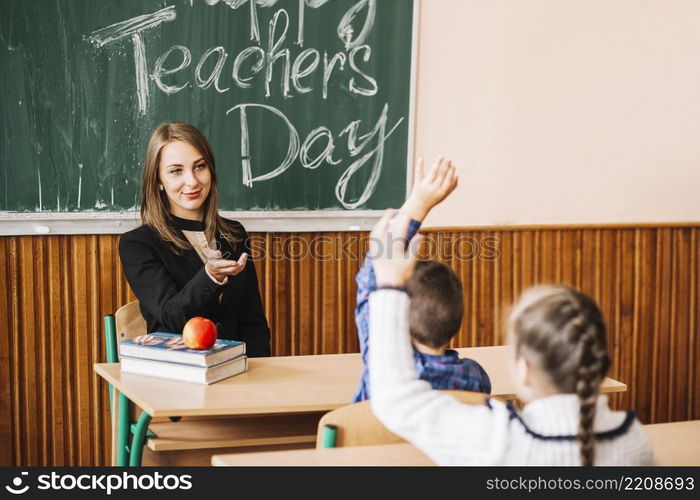 teacher asking pupils