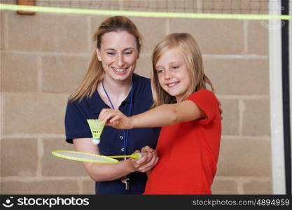 Teacher Giving Female Pupil Badminton Lesson