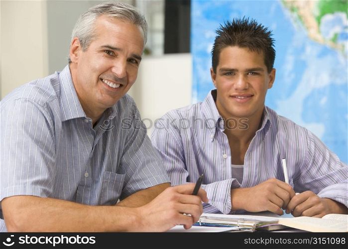 Teacher giving personal instruction to male student