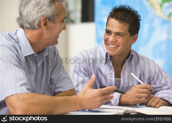 Teacher giving personal instruction to male student