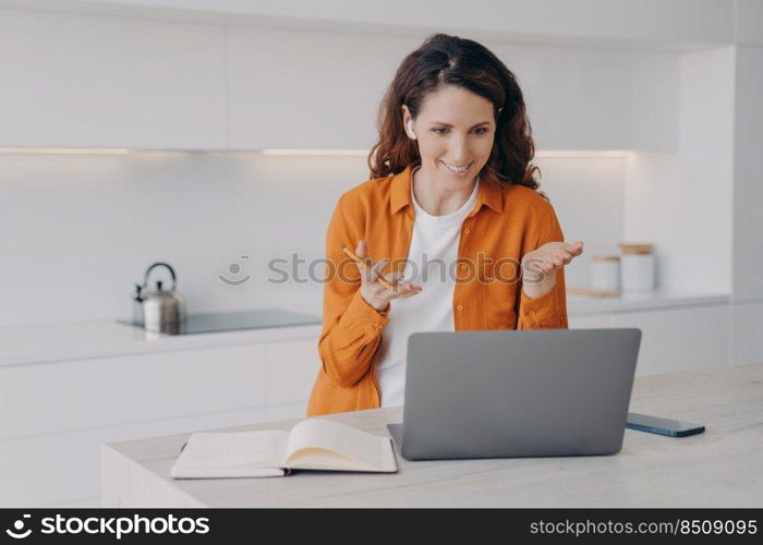 Teacher has lesson online on laptop. Female european tutor is teaching her students language online. Remote class and distance education at home on quarantine. E-learning via zoom.. Teacher has lesson online on laptop. Remote class and distance education at home on quarantine.