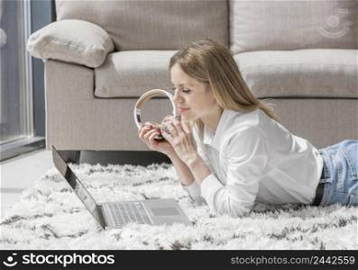 teacher having online class while staying floor