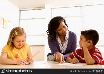 Teacher Helping Students With Schoolwork