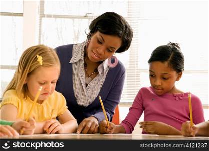 Teacher Helping Students With Schoolwork