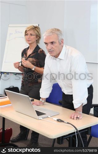 Teacher in classroom with assistant
