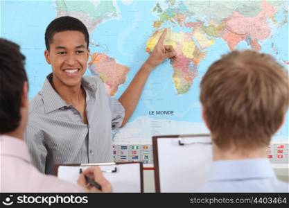 Teacher in geography class