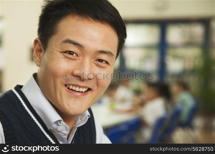Teacher portrait at lunch in school cafeteria