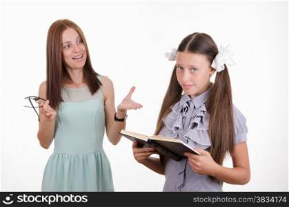 Teacher scolds the student responsible for the book