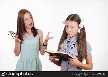 Teacher scolds the student responsible for the book