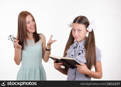 Teacher scolds the student responsible for the book