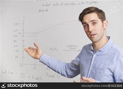 Teacher Standing In Front Of Whiteboard