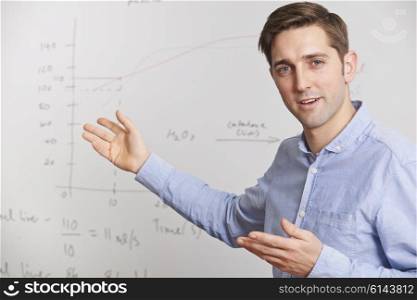 Teacher Standing In Front Of Whiteboard