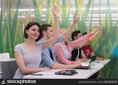 teacher teaching lessons, smart students group raise hands up in school classroom